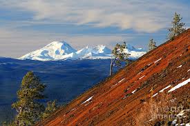We snowy mountains (literally), we basically have every type of coast you could imagine in every temperature you could want, we have i live in the city of the blue mountains, where this photo was taken. Mokst Butte Red Cinder Cone And Distant Snowy Cascade Mountains Mts And 3 Three Sisters Wilderness Photograph By Robert C Paulson Jr