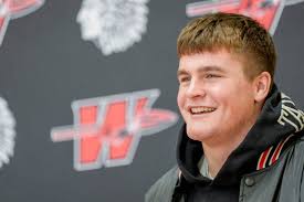 Oklahoma high school football players take part in early signing day