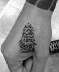 Top 63 Little Hand Tattoo Ideas 2021 Inspiration Guide Hand Tattoos For Guys Small Hand Tattoos Ship Tattoo