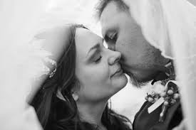 Who can recommend a wedding photographer for April 21st?