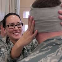 Master Sgt. Henrietta Bouknight greets a visitor to