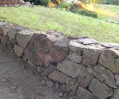 How To Build A Natural Dry Stacked Stone Free Standing Or Retaining Rock Wall Rock Wall Gardens Stone Walls Garden Rock Wall Landscape