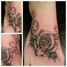 Getting a tattoo on feet may be inspired through different ways: Lovely Realistic Black Rose Foot Tattoo By Johnny B