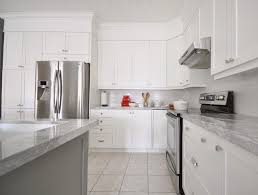 White Shaker Kitchen Cabinets With Marble Countertops Subway Tile Backsplash And Red White Shaker Kitchen White Shaker Kitchen Cabinets Birch Kitchen Cabinets