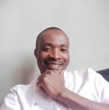 What is causing my car to hard start and smell fuel?