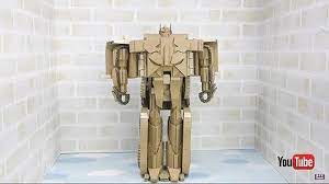 Take a large cardboard box and cut a little door and windows out of it. One Step Changer Optimus Prime Cardboard Edition Youtube Video Showing Handcrafted Simple Change Transformer