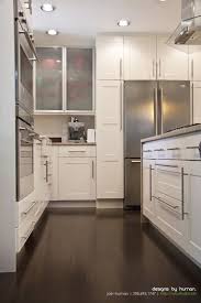 White Cabinets Dark Wood Floors Waterfall Countertop Ikea Kitchen Design Contemporary Kitchen Tall Kitchen Cabinets
