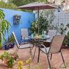 4 chair rattan garden dining set with round table. 1