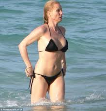 Strong had supporting roles in a number of films. Nicollette Sheridan Splashes About In A Bright Pink Two Piece On St Barts Daily Mail Online