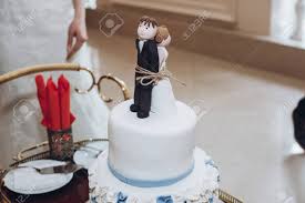 The sturdy oval base keeps this funny wedding cake topper upright. Funny Wedding Cake Topper Figurines Of Bride And Groom Tied Stock Photo Picture And Royalty Free Image Image 88370848