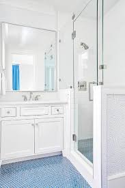 White And Blue Boy S Bathroom Is Clad In Blue Penny Floor Tiles Leading To A White Washstand Adorned Wi Penny Tiles Bathroom Blue Bathroom Tile Blue Tile Floor