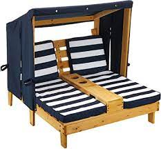 A lounge chair will instantly add to, and often define the personality of a space. Amazon Com Kidkraft Wooden Outdoor Double Chaise Lounge With Cup Holders Kid S Patio Furniture Honey With Navy And White Striped Fabric Gift For Ages 3 8 Toys Games
