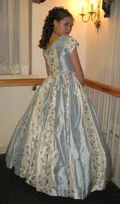 Fluffy rose volants and ruffles are decorated by the same fabric trim, which make alltogether an impression of endless shady rose waves. 1860 Civil War Ball Gown Blue And Cream Tastefully Timeless
