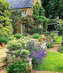 Roses towering hollyhocks, planted in bygone days close to the walls. Pin By Laurel Wagner Designs On Beautiful Gardens Flowers Cottage Garden Design Beautiful Gardens English Cottage Garden