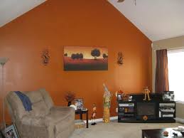 If you're not afraid to double down on paint, take a cue from this scene and embrace a complementary color combo like navy and orange. The Best Living Room Design Burnt Orange Paint Color Living Room