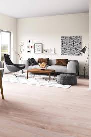 The flooring is pale teak wood paired with white walls, giving a soft, gray ambiance to the space. What Pillows Go With A Gray Sofa 31 Suggestions With Pictures Home Decor Bliss