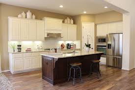 White cabinetry is a classic choice for a kitchen. White Cabinet Dark Island Houzz