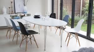 Tabletops with fluid lines draw the eye in. Ellie White Oak Oval Extending Table Oval Table Dining Dining Table Chairs Antique Dining Room Sets