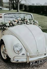 Flower decoration on the handle of a wedding car. Wedding Car Decoration Ideas You Ll Love Wedmegood