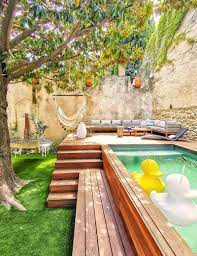 A Raised Lounge Area With A Small Pool Was Designed For This Backyard Small Backyard Pools Backyard Pool Backyard