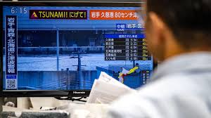 Japan on high alert for 'huge' second earthquake after lifting tsunami warning