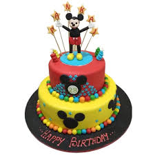 Santa mickey is standing on one side and a christmas tree. Mickey Mouse Clubhouse Cake Online Free Delivery Yummycake