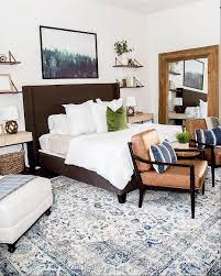 A Rustic Modern Bedroom Featuring The Dominic Saddle Accent Chair And The Damon Stone Platform Bed Photo Vi Simple Bedroom Decor Bedroom Design Simple Bedroom