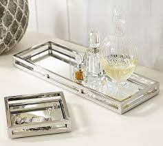 Designed to accommodate items such as a lotion pump and toothbrush holder, these trays are great for creating a more welcoming powder room environment. Brynn Mirrored Trays Mirror Tray Tray Decor Dresser Decor Bedroom