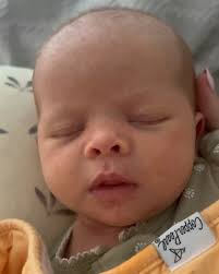 sweet baby Charlotte is one month old today and I am NOT ok😭. our smiley  girl loves to snuggle, to have her hands