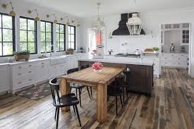 Country Kitchen Boasting A Chunky Dining Table With Black Chairs Next To An Island Topped Wit Diy Kitchen Renovation Kitchen Island Dining Table Kitchen Design