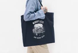 Download Premium Psd Of Tattooed Woman In A Blue Linen Shirt Holding A Black Tote Bag Linen Shirt Blue Linens