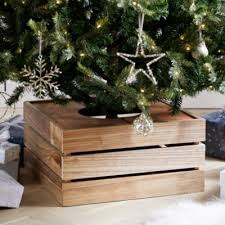 You could always take a cardboard box and some fleece to create the most cozy and perfect tree stand around. Wooden Crate Tree Skirt Natural One Size Wooden Crate Christmas Tree Decorations Christmas Tree Box Stand