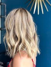 Long blonde grey hair with waves and a cool hair cut. Buttercream Blond Is The Prettiest New Hair Color For 2020 Glamour