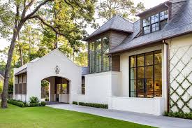 Classic two story painted brick alabama luxury homes mansions. Painted White Brick Exterior With Black Trim Is A Popular Trend In Houston
