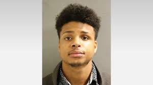 Man accused of impersonating cop, using passport as identification