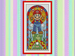 There is a grid made up of tiny squares. 10 Geeky Cross Stitch Patterns
