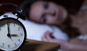 Image result for woman in bed staring at an alarm clock