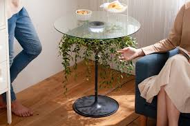 If you're looking for a convenient way to hide clutter, we recommend a storage coffee table. The Oasis Planter Is Actually A Side Table With Lamp Yanko Design