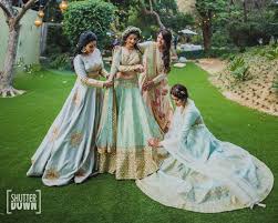 Sangeet Lehengas Bride And Her Bridesmaids In Light Pastel Shade Lehengas Wedmegood Wedmegood Ind Bridesmaid Photoshoot Indian Bridesmaids Ladies Sangeet