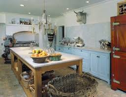 The kitchen hood is a statement piece in a french country kitchen. I Just Wish It Had A Big Window Somewhere Farmhouse Kitchen Design Country Kitchen French Country Kitchens