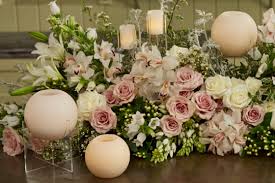Then add wispy florals and small blossoms to start to give the centerpiece shape and density. Everything Flowers At