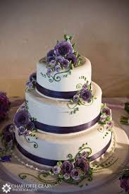 A simple white cake with purple detailings and figurines of the groom proposing the bride. Zahra S Blog Three Tier Green And Whit Scroll Wedding Cake With Purple Satin Ribbon And Purple Wedding Cakes Purple Cakes Purple Wedding Cake