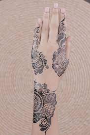 Classy mehendi designs for your beautiful hands. Black Hand Mehndi Tattoos Photo Free Grey Image On Unsplash