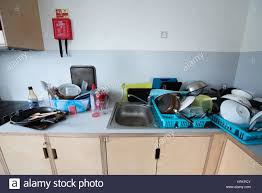 dirty messy student shared kitchen with