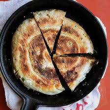 Chinese Panfried Bing Bread Stuffed With Caramelized Onions Garlic Scallions And Ground Sesame Seeds Vegan Baking Bread Recipes Food Recipes