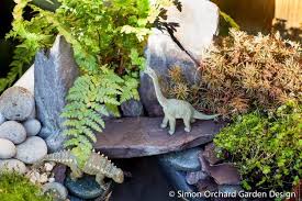 How To Create A Mini Dinosaur Garden Simon Orchard Garden Design In 2020 Dinosaur Garden Orchard Garden Garden Types