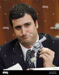 Marc Dupre, state Forensic Lab Analyst, shows jurors the gun Michael Addison  used in attempt to shoot a high school classmate in 1996 during the  sentencing phase of Michael Addison's capitol murder