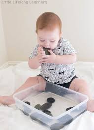 Pebble And Water Sensory Tub For Babies Little Lifelong Learners Infant Activities 9 Month Old Baby Activities Baby Sensory Play