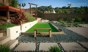 Design ideas for a small tropical full sun backyard retaining wall landscape in sydney with decking. Tropical Landscape Design Tropical Landscaping In San Diego