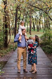 Daughter Sits On Dads Shoulders And Family Stands In The Woods Fall Family Photos Shawnee Outdoor Family Photos Fall Family Photos Outdoor Family Photos Fall